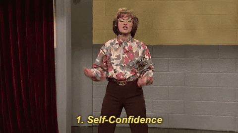 woman fist pumping with self confidence gif